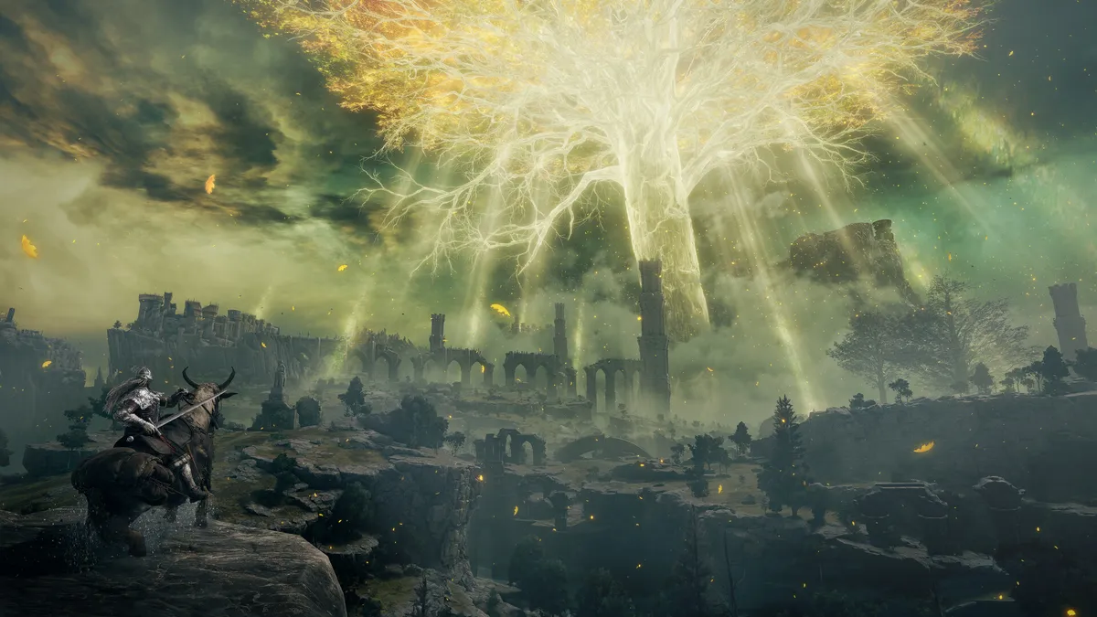 Rider on horseback overlooking ruins beneath the glowing golden Erdtree