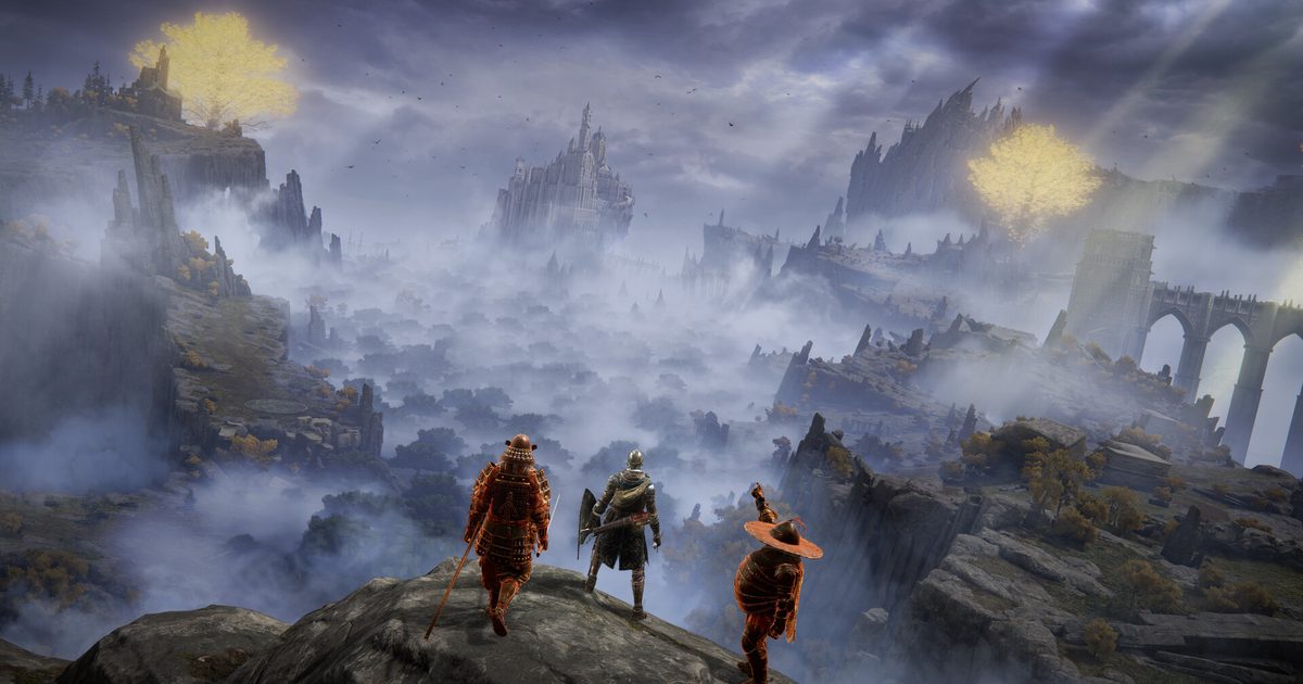 Three players standing on a rock above a misty valley with a distant castle and bridge