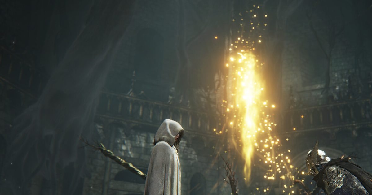 A hooded white-robed figure beside a shower of golden sparks in a dark stone hall